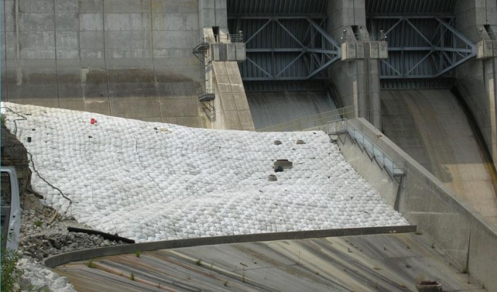 AB concrete lining for dam face spillway