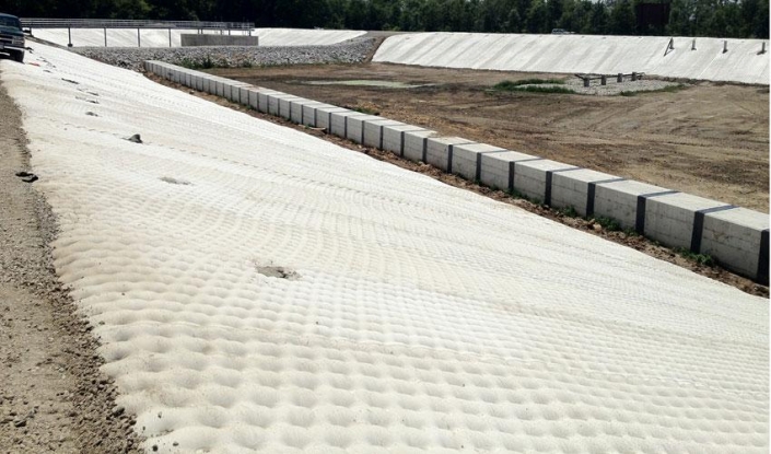 FP fabric formed concrete liner for wastewater basin